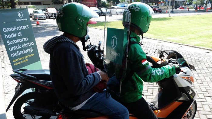 Kiat Aman Naik Ojek Online saat New Normal